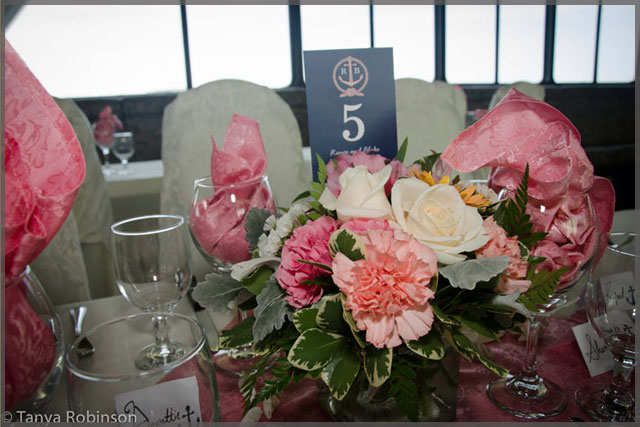 Wedding centrepiece with pink and white flowers.