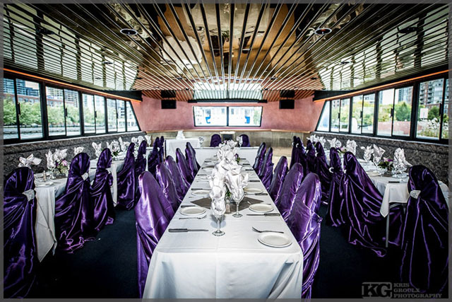 Wedding decor with mauve chair covers.